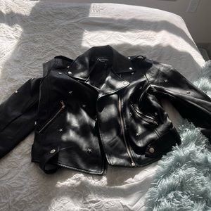 Leather jacket with star emblems